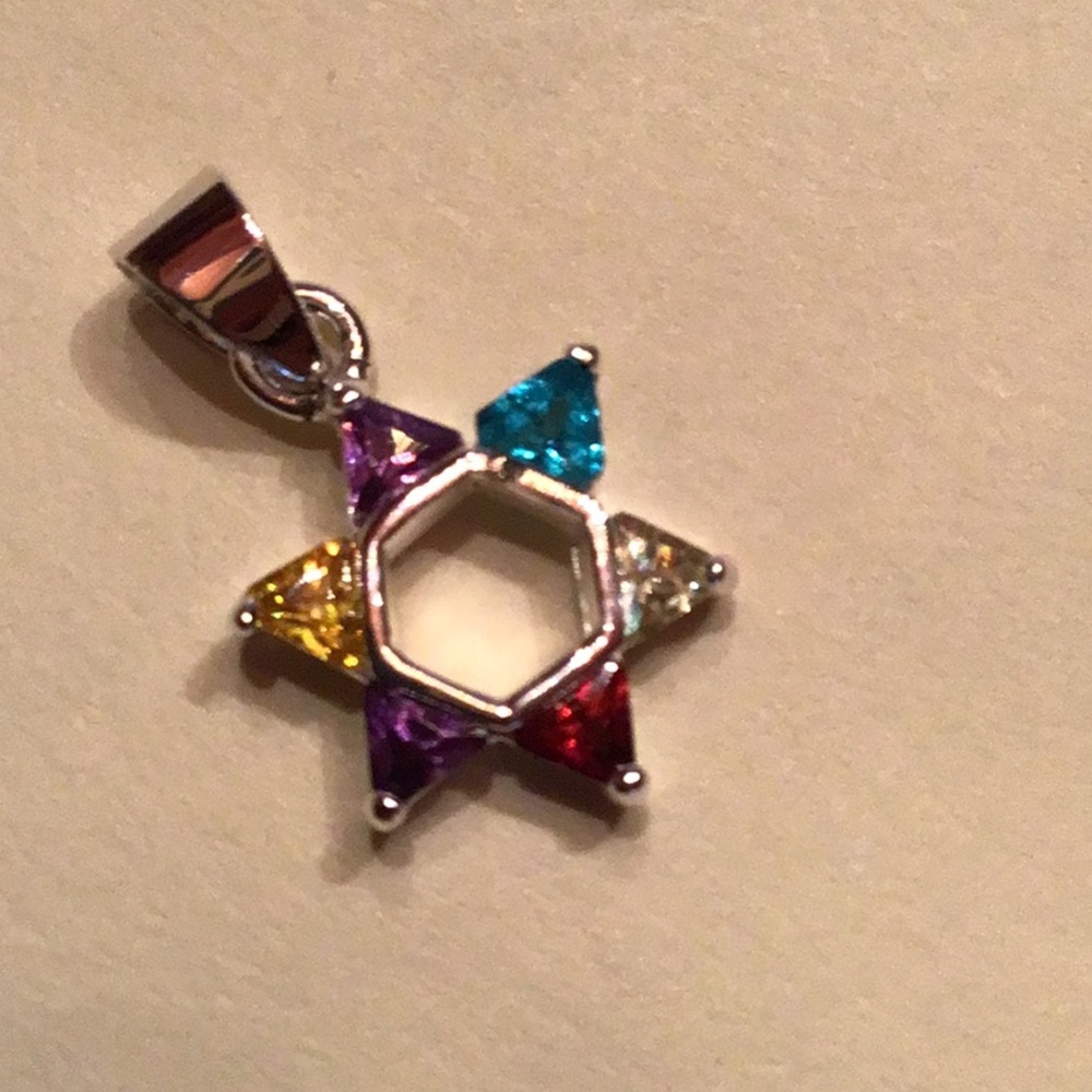 New Sterling Silver Star of David pendant. Multicolored CZ’s. 1/2”dia no chain